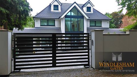 Modern detached house with electric gates on the driveway