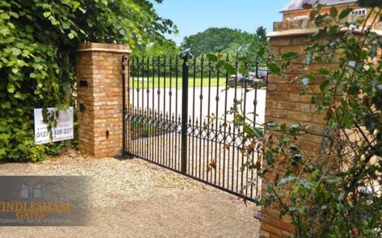 Electric gate with brick columns